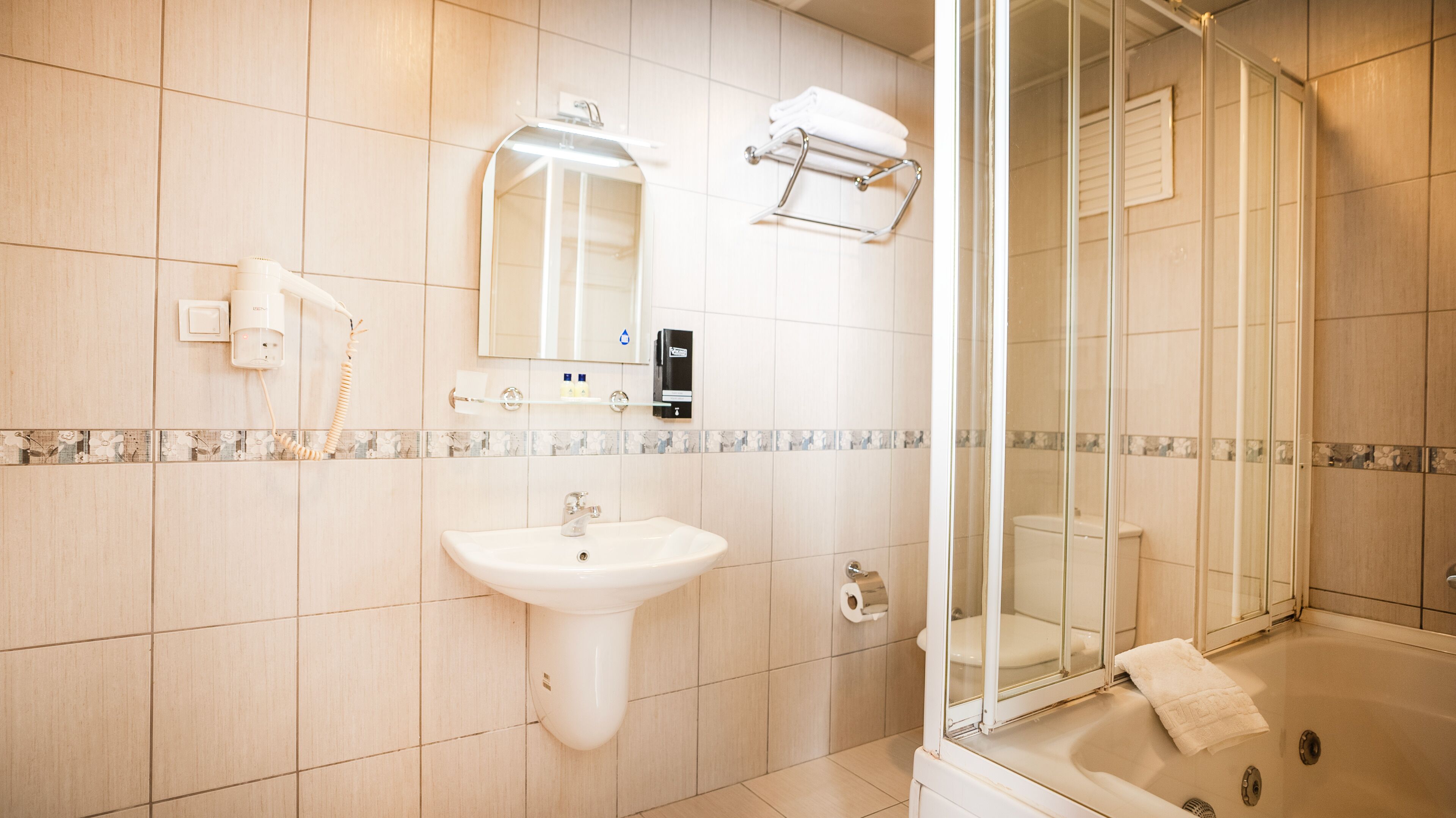 suite | bathroom | shower, designer toiletries, hair dryer, slippers