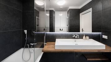 Suite, 1 Bedroom | Bathroom | Shower, free toiletries, hair dryer, towels