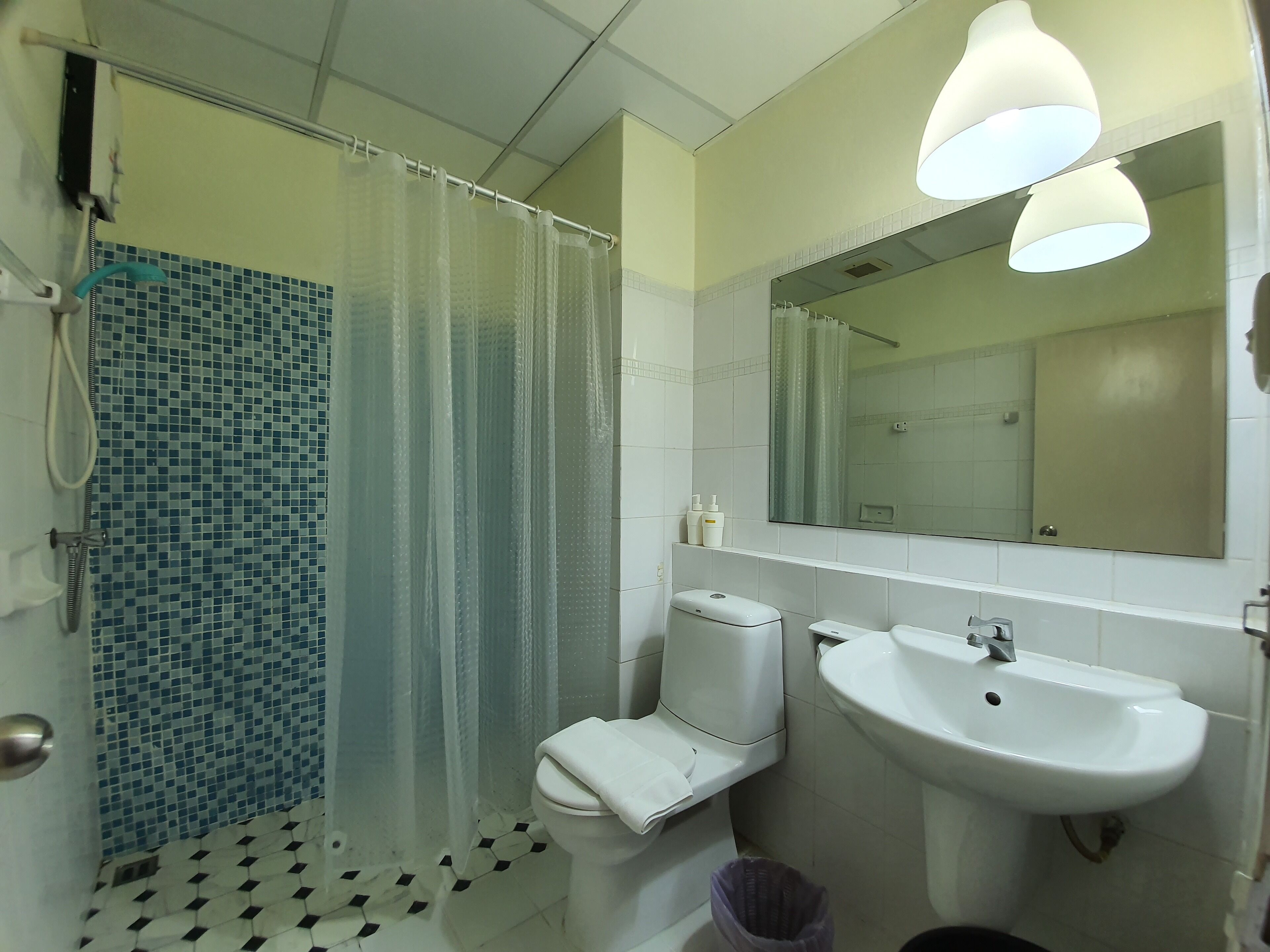 city balcony studio apartment: queen bed + sofa bed + working desk | bathroom | shower, hydromassage showerhead, free toiletries, hair dryer