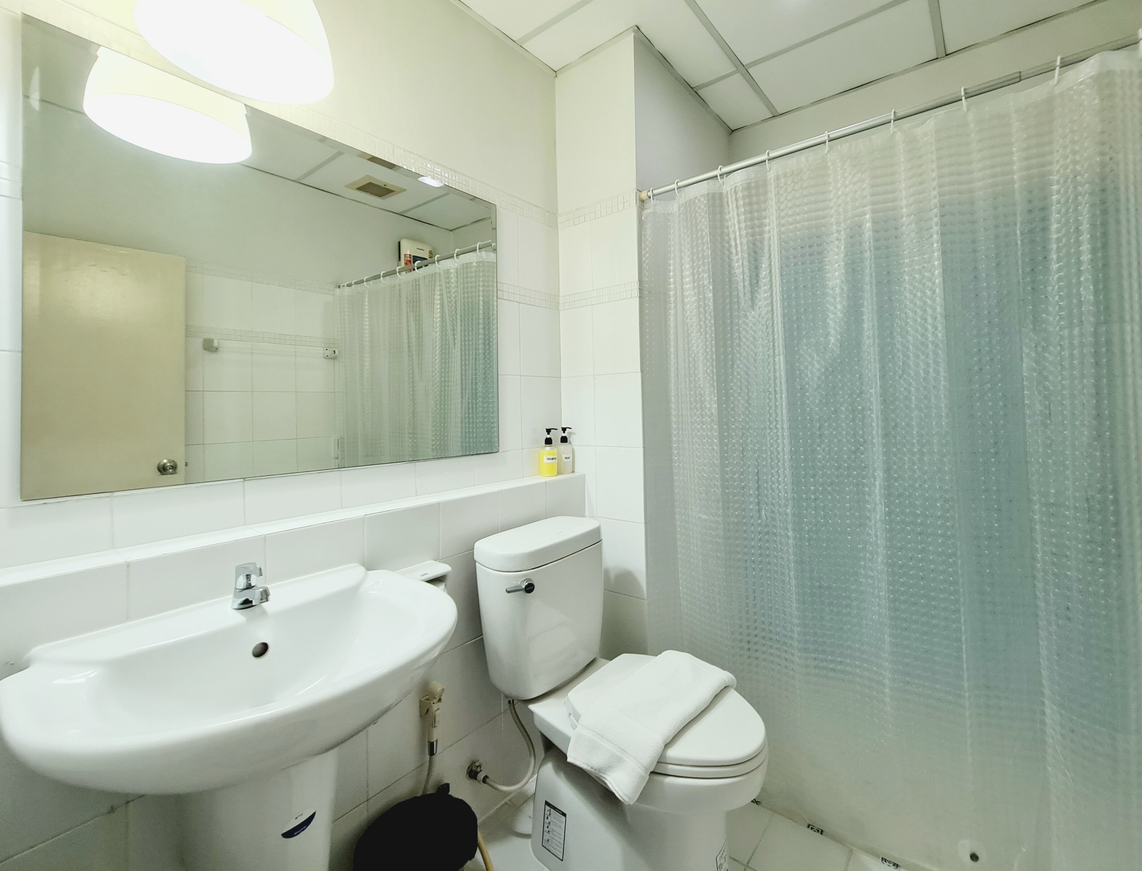 icon siam view studio apartment: queen bed + sofa bed + working desk + non-smoking | bathroom | shower, hydromassage showerhead, free toiletries, hair dryer