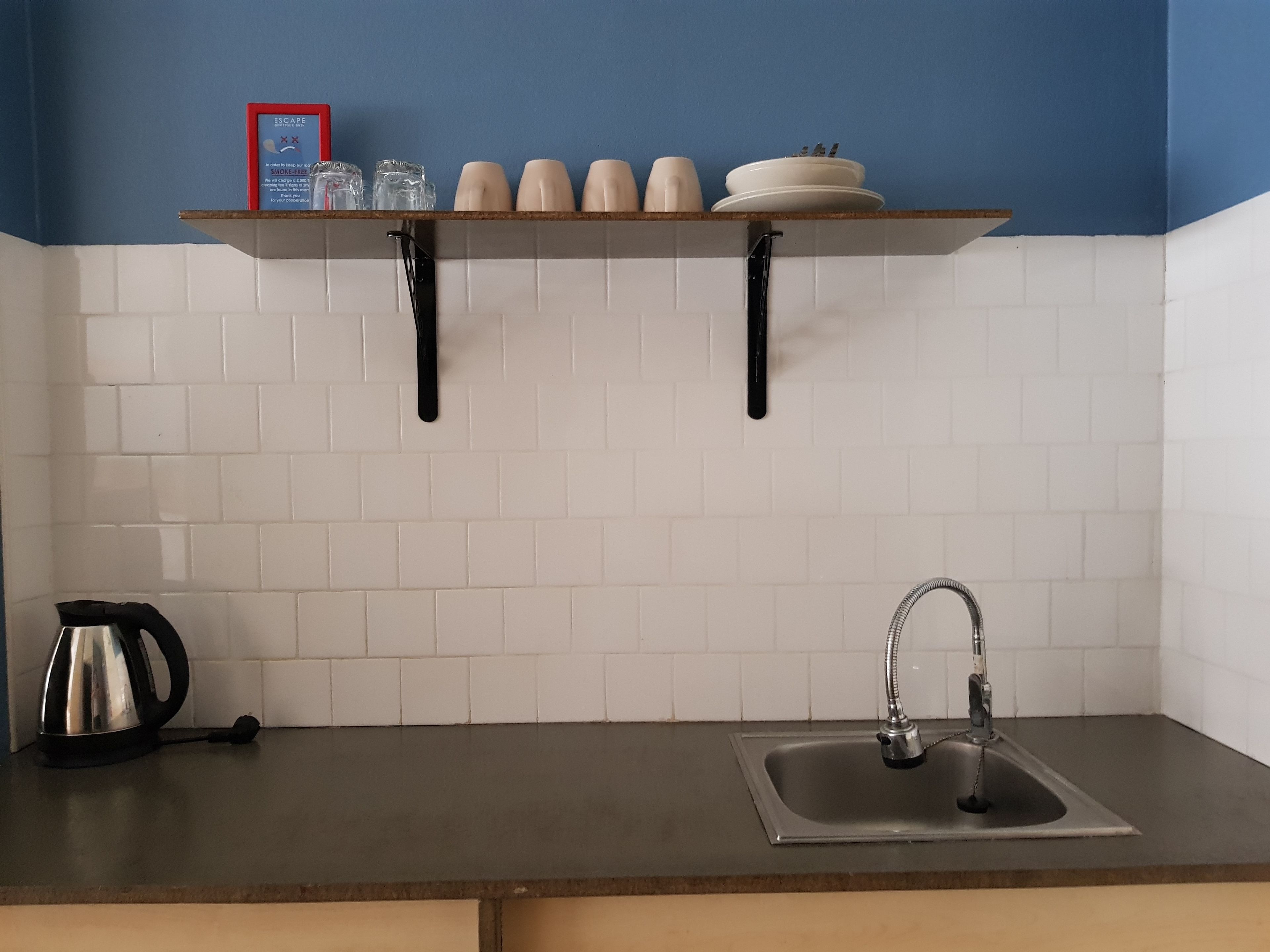 fridge, electric kettle, cookware/dishes/utensils