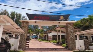 A resort entrance with a sign for Al-Safina Kijai Beach Resort & Restaurant.