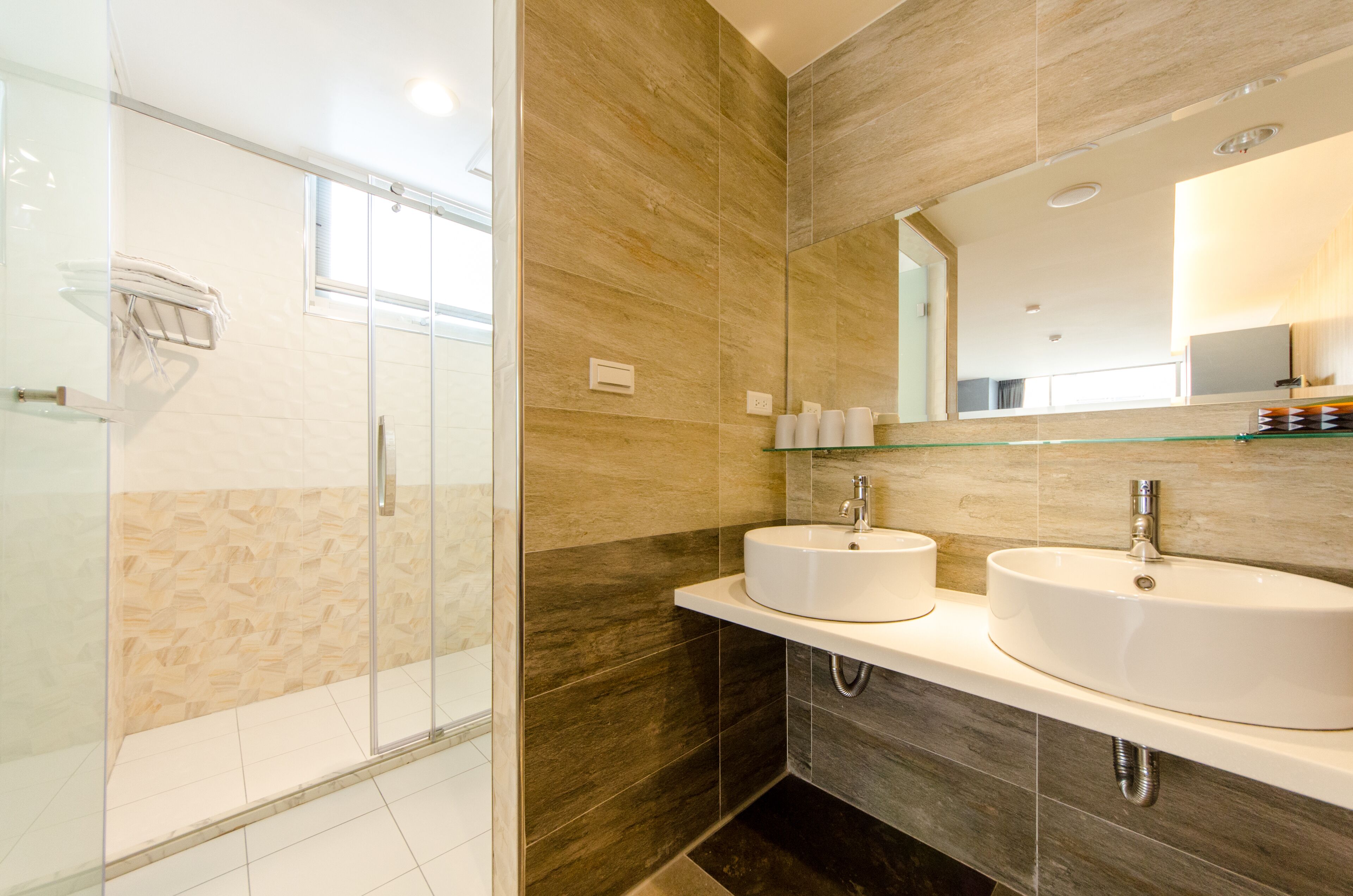 deluxe quadruple room | bathroom | shower, free toiletries, hair dryer, slippers