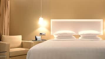 Ropa de cama de alta calidad, minibar, caja fuerte y escritorio