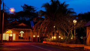 A building with a symmetrical facade, large windows, and a central entrance. - RUMBIA RESORT VILLA Paka Terengganu  (Dungun)