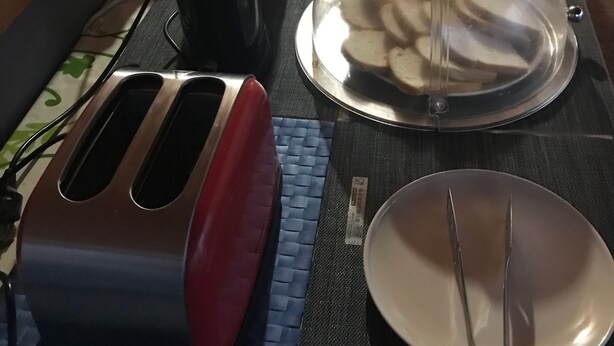 A breakfast buffet setup with various food items and kitchen appliances. - La Casa Di Elena (Rome)