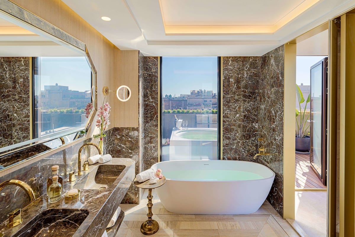 suite sagrada familia | bathroom | designer toiletries, hair dryer, bathrobes, slippers