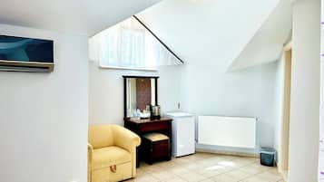 Deluxe Double or Twin Room, Sea View | Minibar, in-room safe, desk, iron/ironing board