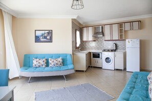 Apartment, Sea View (for 3 or 4) | Living area | LCD TV - Beyaz Konak Evleri (Datça)