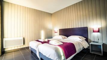 Blackout curtains, soundproofing, free WiFi, bed sheets