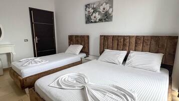 Triple Room, Balcony | In-room safe, free WiFi, bed sheets