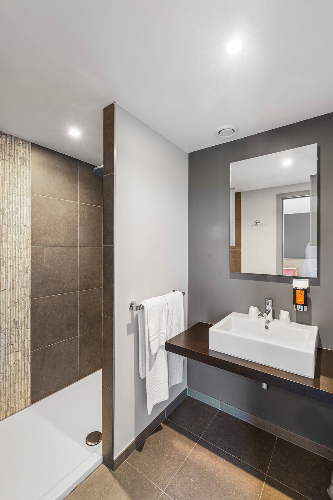 junior suite (connecting suite) | bathroom | hydromassage showerhead, designer toiletries, hair dryer, towels