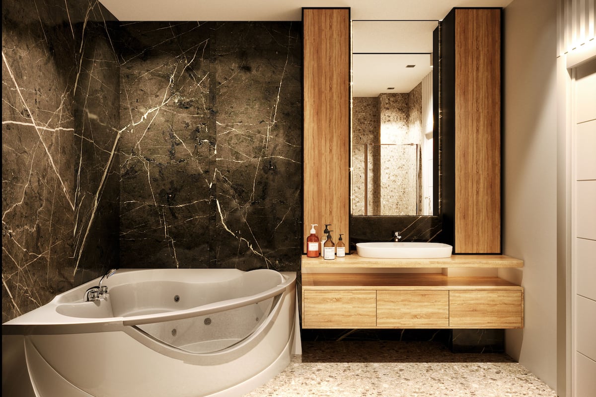 A modern bathroom with a freestanding bathtub, a wooden vanity, and a large mirror.