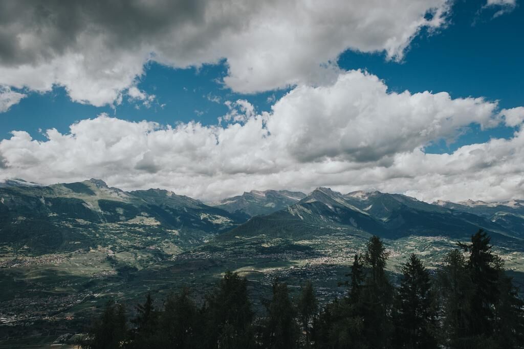 A mountainous landscape with a town in the valley.
