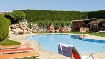 Seasonal outdoor pool, pool loungers