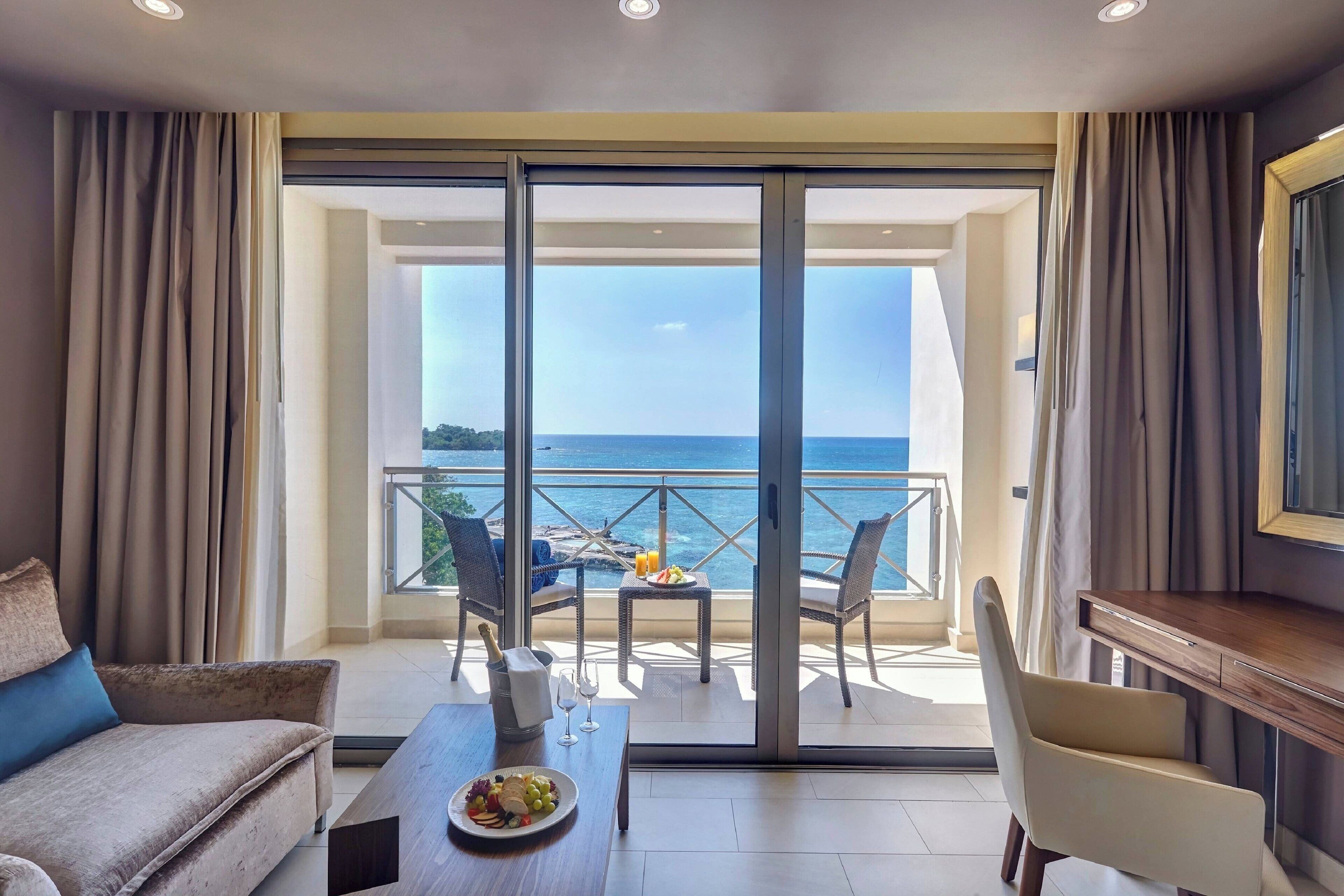 Sunset Ocean View Suite | Premium bedding, minibar, in-room safe, individually decorated