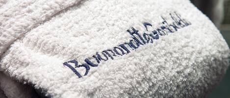 A white towel with embroidered text.