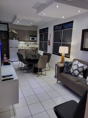 FAMILY TWO BEDROOM W/KITCHEN | Living room | 32-inch TV with cable channels - Luichy's Seaside Hotel (Cabo Rojo)