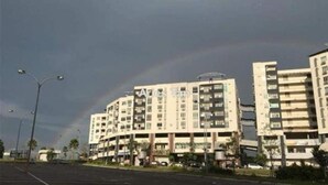 A multi-story building with balconies, a parking lot, and street lamps. - Aeon Tebrau Apartment Johor Bahru (Johor Bahru)