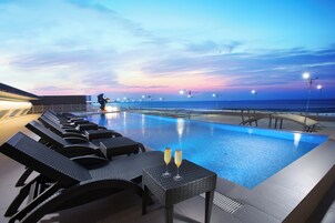 Seasonal outdoor pool, open 2:00 PM to 9:00 PM, sun loungers