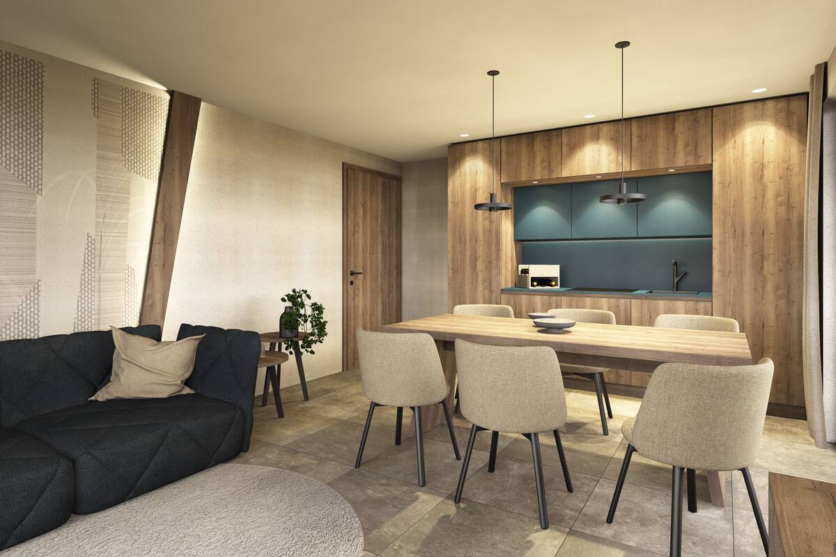 A modern living room with a dark sofa, a round coffee table, and a dining area with a wooden table and four chairs.