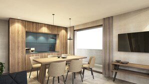A modern kitchen with wooden cabinetry, a built-in island, and pendant lighting. - Aparthotel Kronplatz Luxury House (Valdaora)