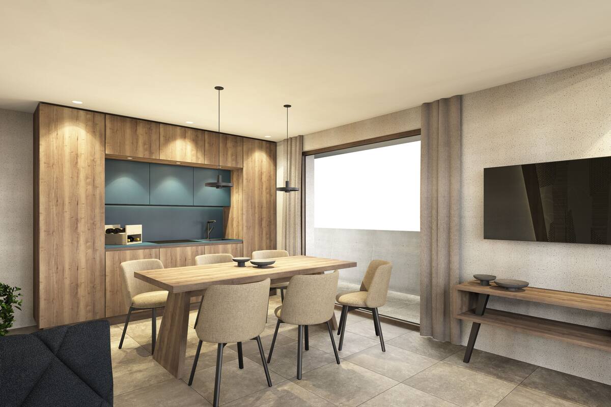 A modern kitchen with wooden cabinetry, a built-in island, and pendant lighting.
