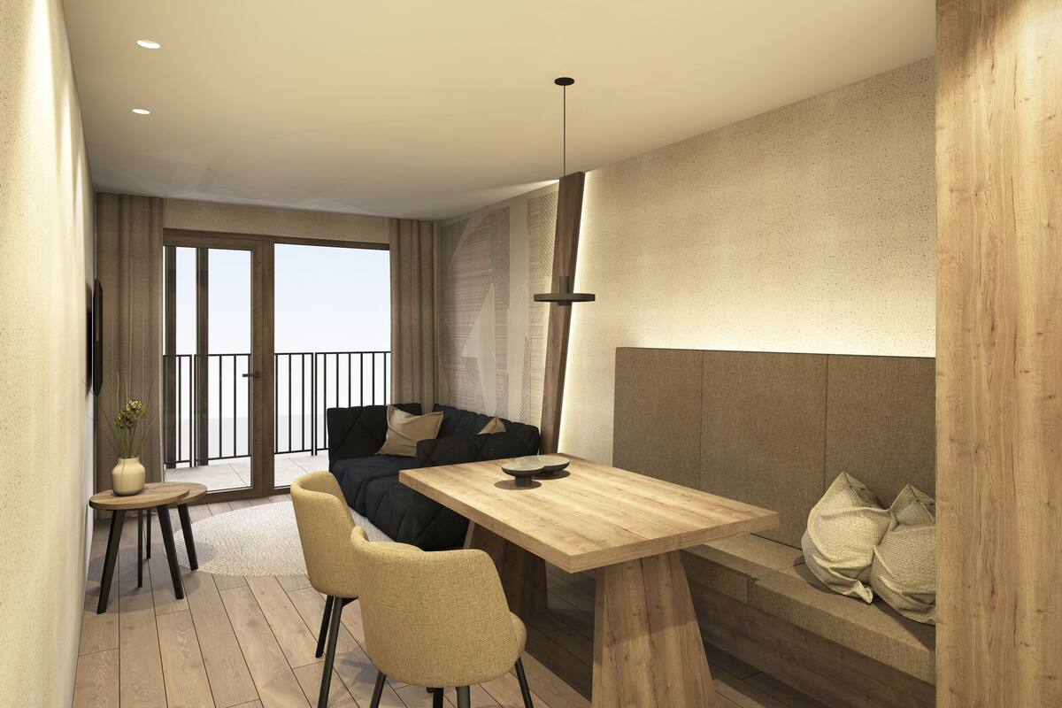 A modern living space with a wooden dining table, a sofa, and a balcony with a view.