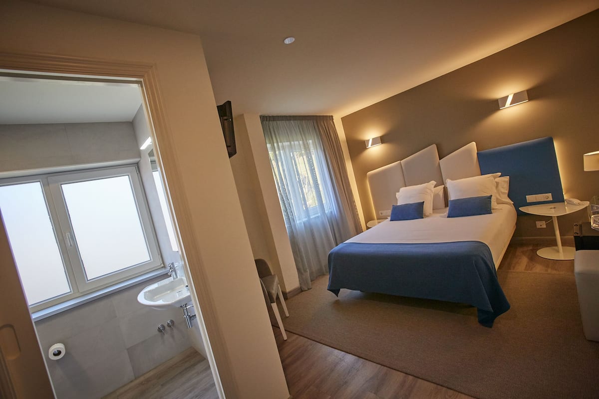 Camera singola | Biancheria da letto di alta qualità, minibar, una cassaforte in camera