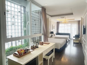 Family Suite, Balcony | Living area | 42-inch Smart TV with cable channels, TV, fireplace