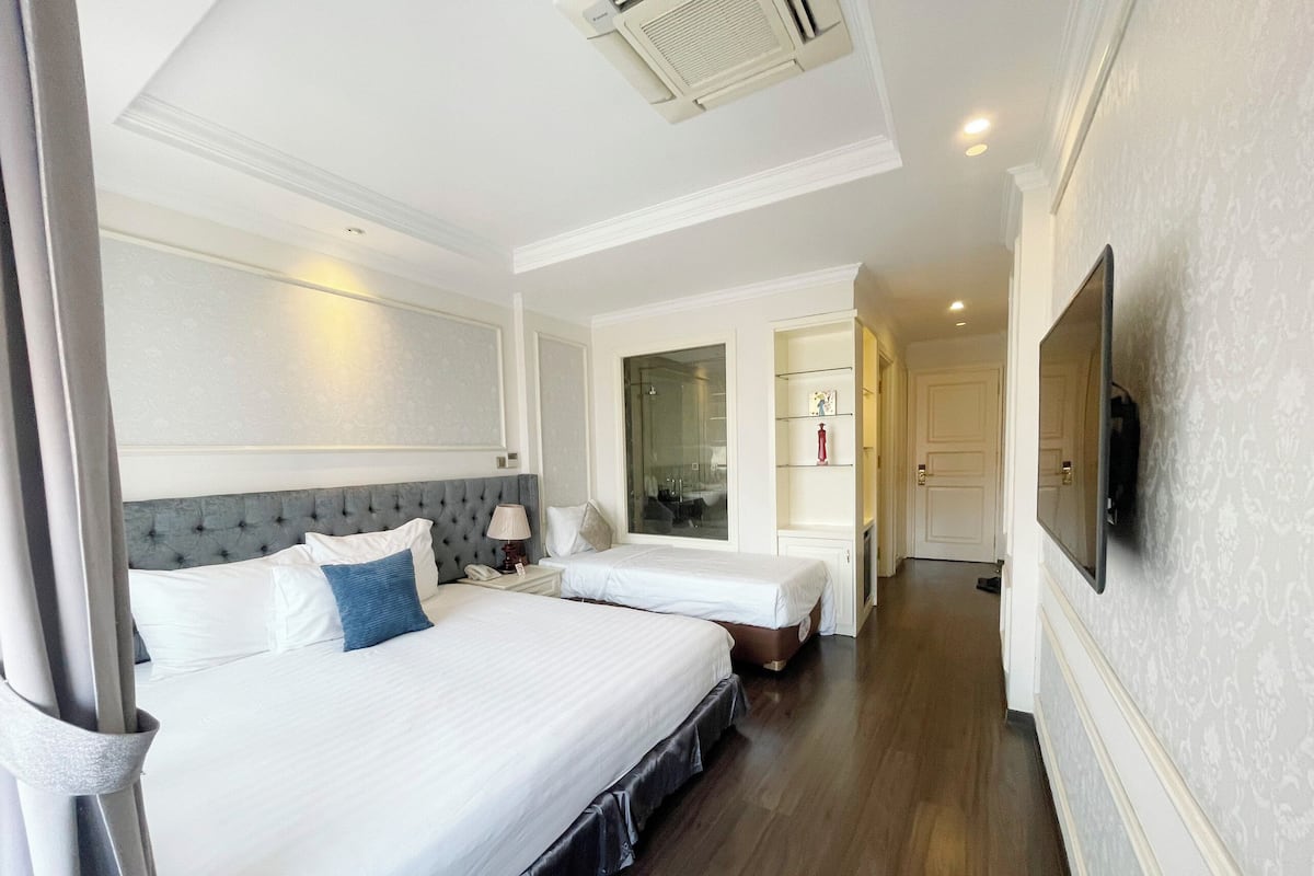 Family Triple Room, 1 Bedroom | 1 bedroom, free minibar items, in-room safe, individually decorated