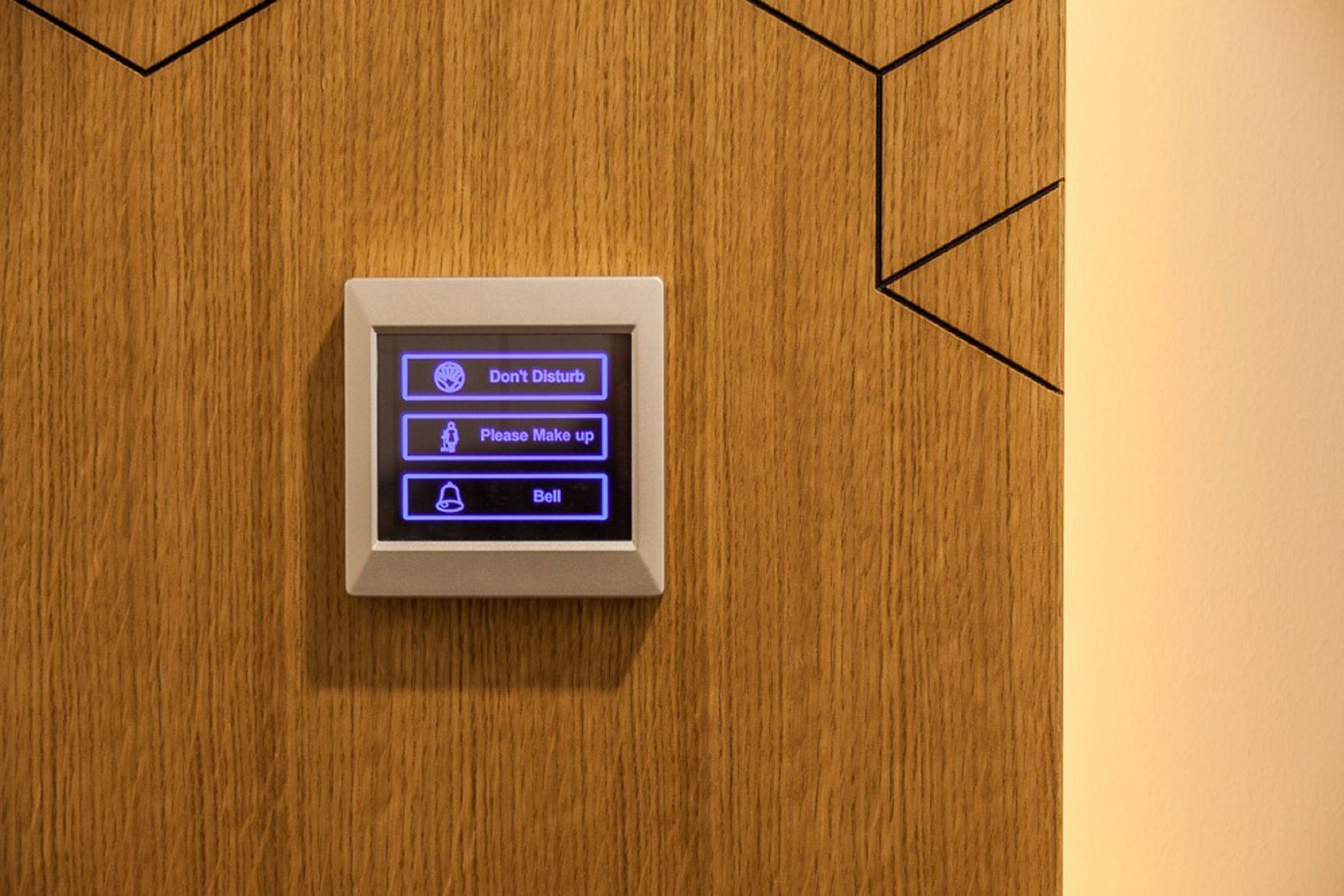 A digital intercom with options to 'Don't Disturb,' 'Please Make up,' and 'Bell.'