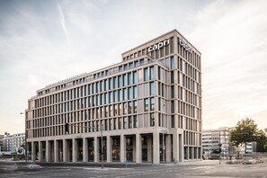 A modern building with a prominent 'Capri' sign on the top. - Capri by Fraser Berlin (Berlin)