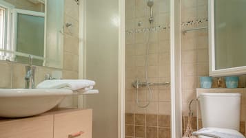 Shower, rainfall showerhead, hair dryer, towels