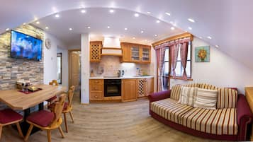 Traditional Apartment, 1 Bedroom, Balcony, Mountain View. | Living area | Flat-screen TV