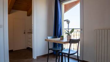 Superior Studio Suite | Living area | Flat-screen TV