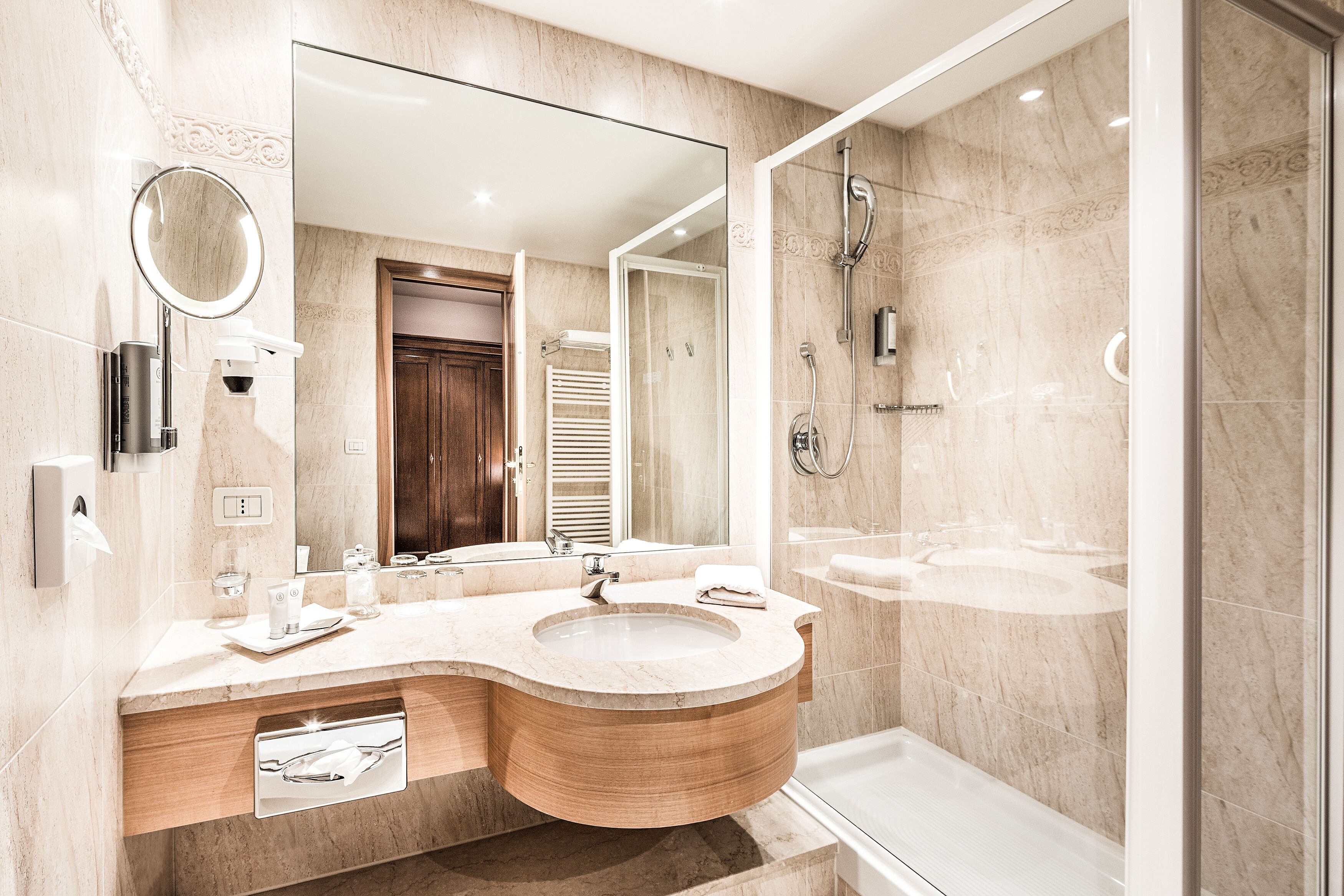 designer toiletries, hair dryer, bathrobes, slippers