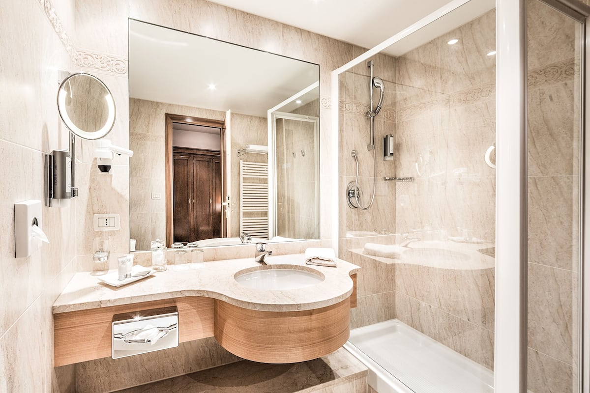 designer toiletries, hair dryer, bathrobes, slippers