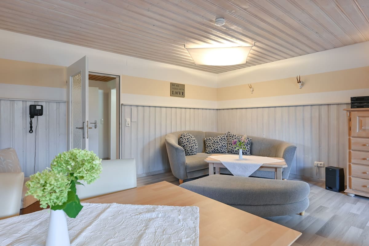 Comfort Condo, 2 Bedrooms, Garden Area | Living area | Flat-screen TV, toys
