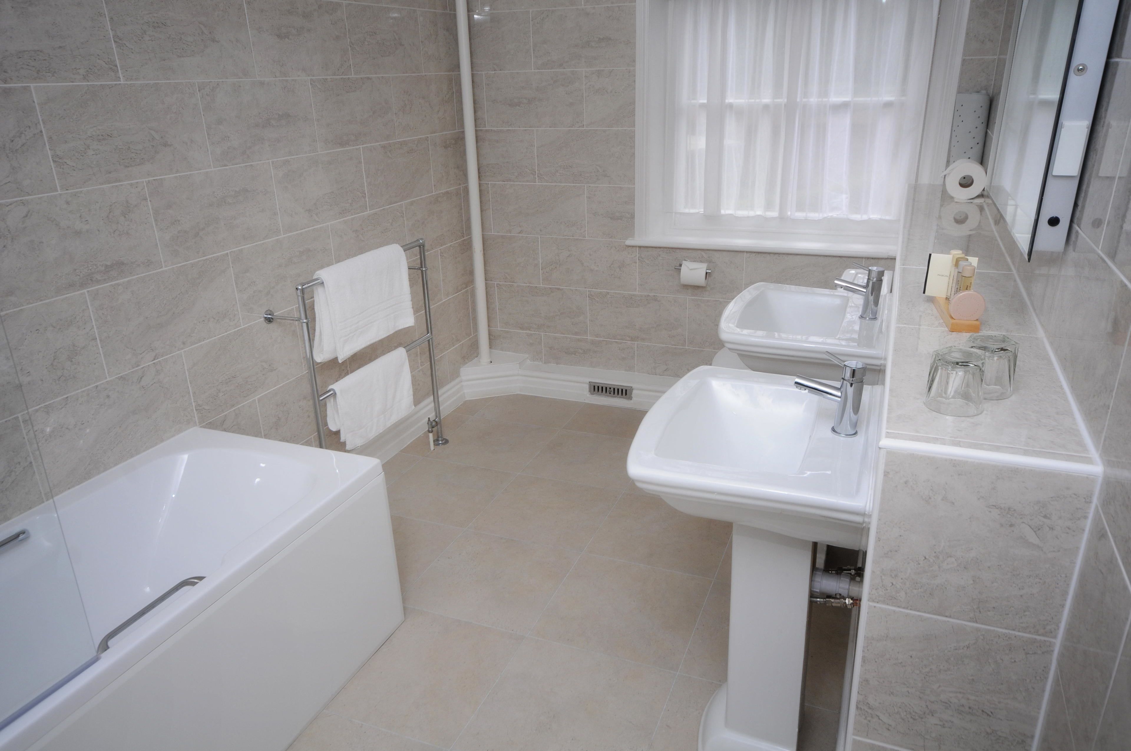 combined shower/bathtub, free toiletries, hair dryer, dressing gowns
