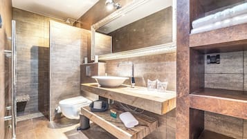 Deluxe Condo | Bathroom | Shower, designer toiletries, hair dryer, slippers