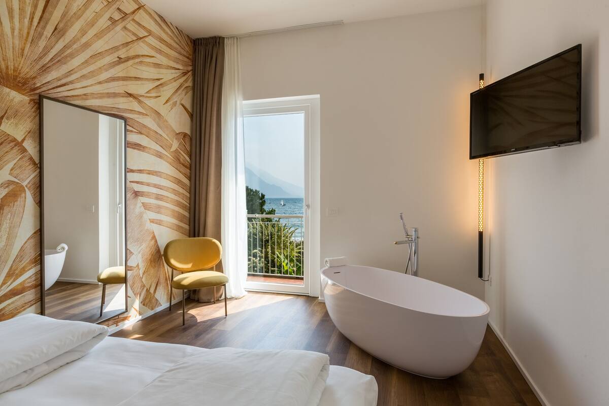 signature double room, lake view | 1 bedroom, in-room safe, desk, blackout curtains