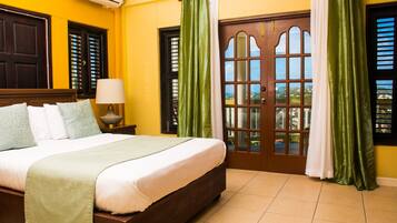 Deluxe Apartment, 2 Bedrooms, Pool View, Oceanfront | Premium bedding, in-room safe, individually decorated