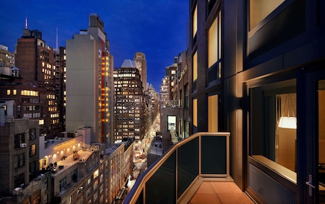A high-rise building with multiple floors, large windows, and a modern architectural design.
