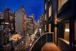A high-rise building with multiple floors, large windows, and a modern architectural design.