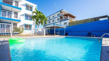 2 outdoor pools, open 9:00 AM to 8:00 PM, pool loungers