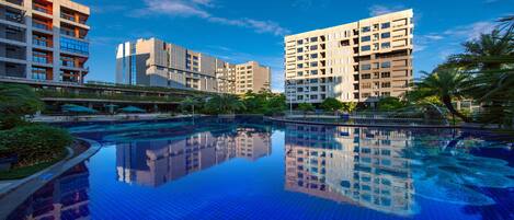 Seasonal outdoor pool, open 9 AM to 8 PM, pool umbrellas
