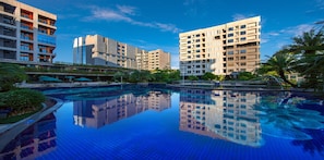 Seasonal outdoor pool, open 9 AM to 8 PM, pool umbrellas