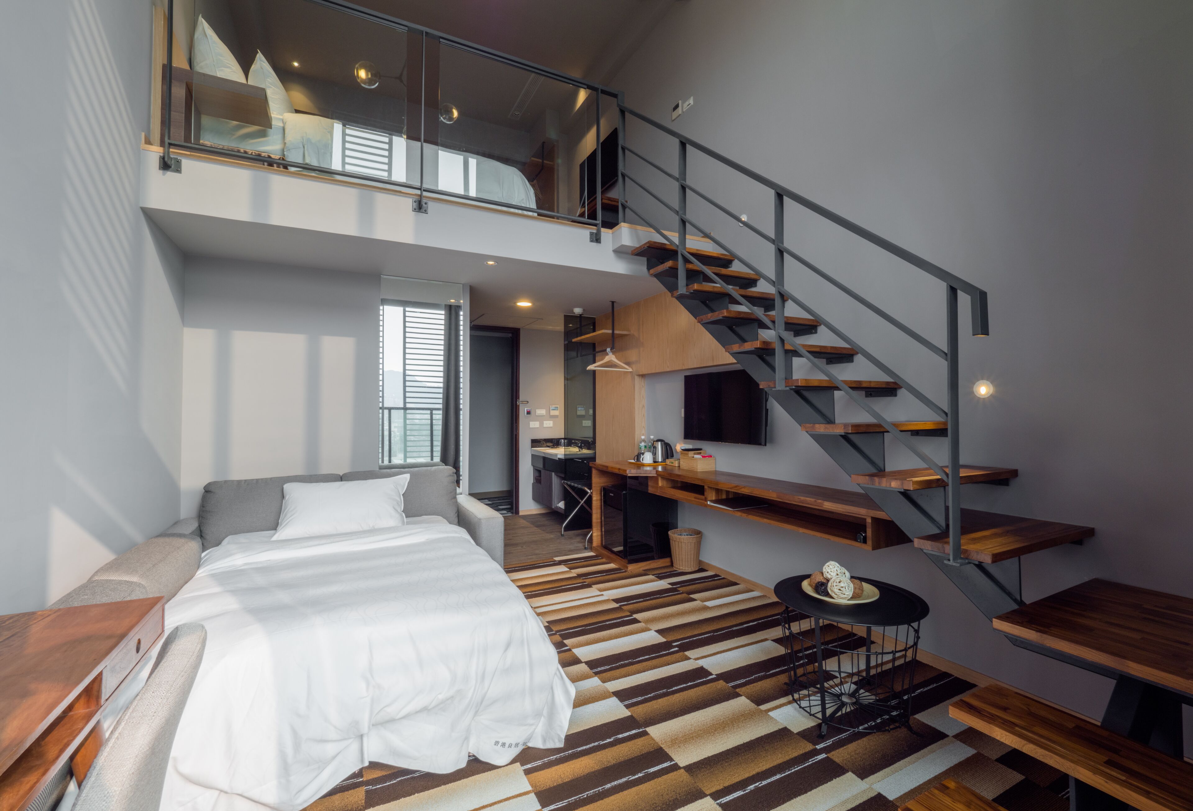 Down comforters, desk, blackout drapes, soundproofing