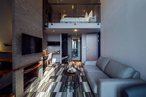 Grand Loft | Down comforters, desk, blackout drapes, soundproofing